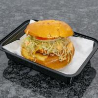 Chicken Chimi Burger · Seasoned chicken breast topped with cabbage, onions, tomato, and a yummy mayo ketchup sauce.