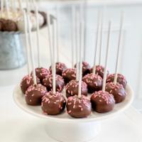 Chocolate Covered Strawberry Cake Pop · Strawberry cake dipped in chocolate and accented with pink sprinkles. Yum! All cake pops are...