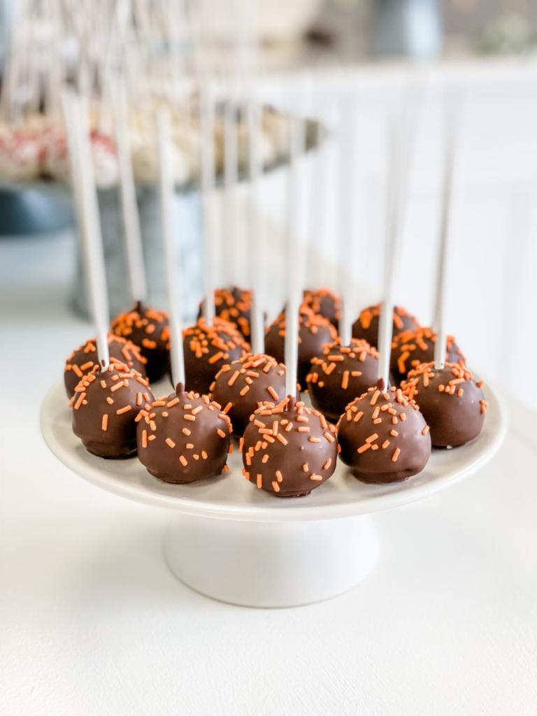 Orange Chocolate · Our moist orange cake dipped in chocolate and covered in orange sprinkles. If you like an orange + chocolate combo, this is the cake pop for you. All cake pops are individually wrapped.