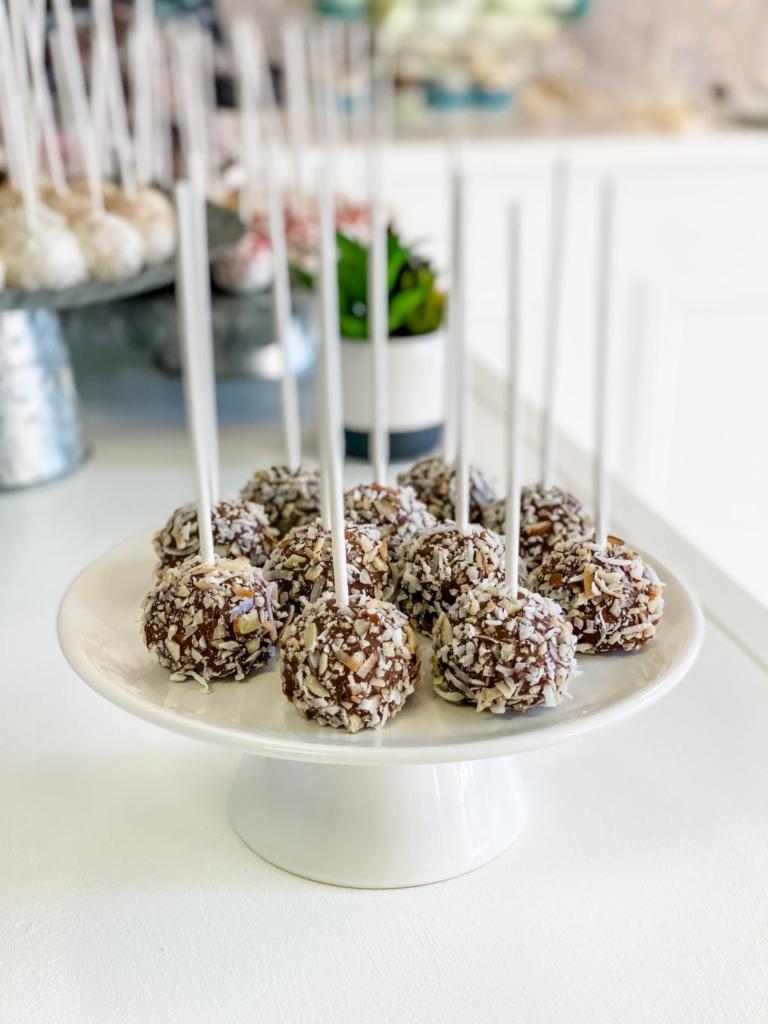 Almond Joy Cake Pop · An almond coconut cake dunked in milk chocolate and covered in crushed almonds and toasted coconuts. Addicting and delicious! All cake pops are individually wrapped.