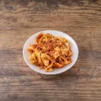 Pappardelle Bolognese · Classic tomato and meat sauce.