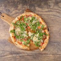 Arugula Pizza · Tomato sauce, mozzarella, prosciutto, arugula and shaved Parmigiano.