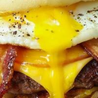 Heart-attack Burger · Double Burger 🍔 and bacon 🥓 and Three diffferent layers of Cheese 🧀 and egg 🍳 on a sesam...