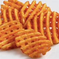 Waffle Fries · Hot and crispy waffle fries with cheese sauce on the side
