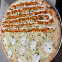 13. White Pizza · Ricotta, Parmesan, fresh garlic, mozzarella, and pesto sauce.