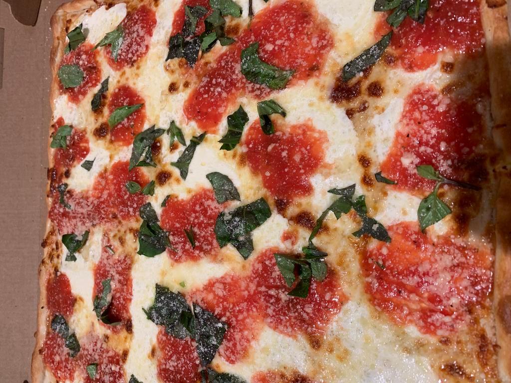 18. Margharita Pizza · Fresh mozzarella, Parmesan, extra virgin olive oil and fresh basil.