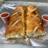 Meat lovers Stromboli · Mozzarella cheese Pepperoni, bacon, sausage and ricotta cheese.on the side marinara sauce 