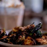 Crispy Brussels · Flash fried Brussels sprouts tossed in a maple glaze