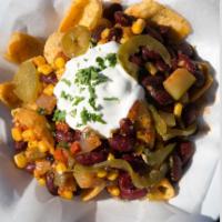 Vegetarian Chili Nachos · Vegetarian chili, house made corn tortilla chips, cheddar cheese, pickled jalapenos and sour...