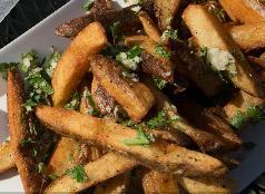 Branded Fries · Thick cut fries, fresh garlic, and herbs.