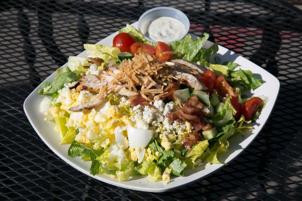 Cobb Salad · Romaine, Grilled Chicken, Bacon, Tomato, Cucumber,  Hard Boiled Egg, Blue Cheese Crumbles,  Ranch Dressing 