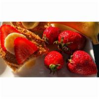 S&S Toast - Sweet and Savory! · Freshly Ground Peanut Butter on French Boule Bread, topped with Sliced Strawberries, Banana,...