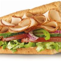  Sliced Oven Roasted Turkey · stacked high with thinly cut slices of Oven Roasted Turkey Breast and served on freshly bake...