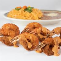 Camarones Empanizados con Aderezo Casero · Servido con arroz, frijoles, guacamole y tortilla o pan. Served with rice, beans, guacamole,...