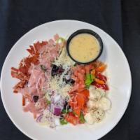 Chop Chop Salad · Chopped greens, pepperoni, prosciutto, red onions, cherry peppers, diced tomatoes, artichoke...