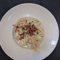 Chicken Gorgonzola · Penne pasta tossed in a light gorgonzola sauce topped with sliced herb chicken and chopped b...