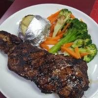 Rib Eye Steak · Served with salad, bread, potato and vegetable.
