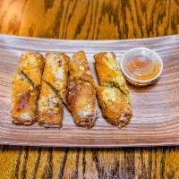 Philly Egg Rolls · Sauteed steak, peppers, onions, pepper jack cheese, served with country sweet.