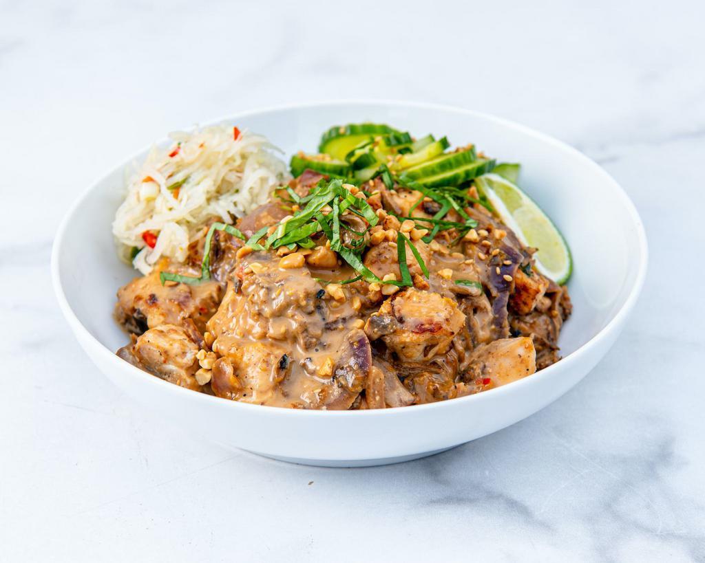 Peanut Chicken Satay Bowl · Antibiotic-free roasted chicken with caramelized onions, roasted mushrooms, papaya slaw, cucumber slaw, basil, sesame seeds, roasted salt-free peanuts, and our peanut sauce. Served with a lime wedge and a base of your choice. (gluten-free)