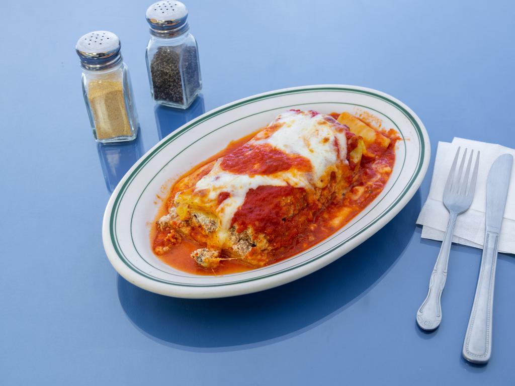 Lasagna · Sheets of pasta with layers of ground beef, ricotta, melted mozzarella cheese with tomato sauce 