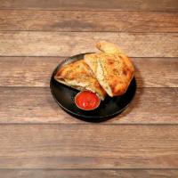 Cheese Calzone · Vegan cheese, ricotta and red sauce. Add fillings for an additional charge.