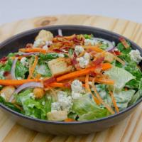 House Salad Aka Annie Oakley · Mixed greens, bacon, blue cheese, tomatoes, croutons, house-made lemon basil dressing. Crisp...