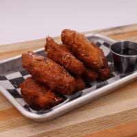 Chicken and Waffle Wings Aka Sam Bass · Waffle batter, maple syrup, powder sugar. 8 hand-tossed crispy wings served with house-made ...
