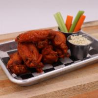 Classic Buffalo Wings Aka Johnny Ringo · Classic frank's red hot sauce and butter. 8 hand-tossed crispy wings served with house-made ...