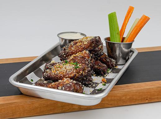 Garlic Parm Wings Aka Joe Newton · Garlic butter sauce, grated Parmesan cheese, chives. 8 hand-tossed crispy wings served with house-made sauce, carrots and celery.