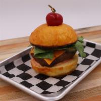 The Gunslinger · 1/2 lb beef patty, Cheddar cheese, lettuce, tomato, house pickles, house dressing- chipotle ...