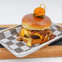 Chili 'N' Cheeseburger Aka Billy the Kid · 1/2 lb beef patty, Cheddar cheese, house made chili, melted cheese sauce, brioche bun. Our c...