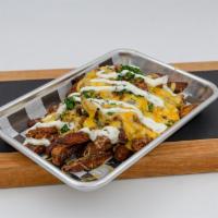 Chili Cheese Fries · Crispy fries, house chili, cheese, red onions, chives. Fries are hand-cut and house-made.