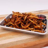 Black Garlic Curly Fries · Curly fries, Texas black gold garlic coffee blackening spice. Fries are hand-cut and house-m...