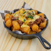 Chili Cheese Tots · Tater tots, chili, cheese, chives.