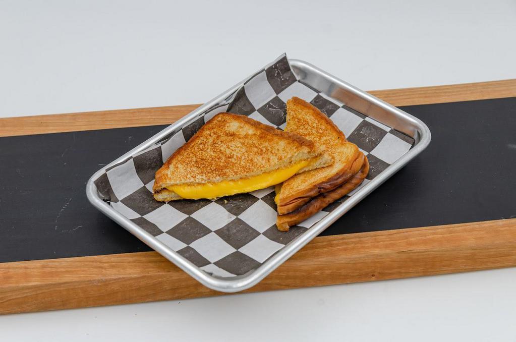 Kids Grilled Cheese · American cheese, Texas toast. Served with fries or tots and a small fountain drink.