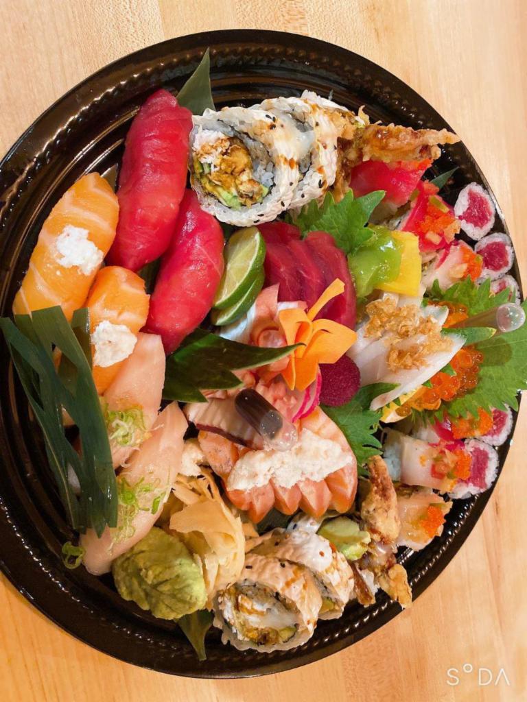 Yokoi Boat · Special sashimi 15 pieces, special sushi 12 pieces, 2 signature roll
And a special sashimi salad.
