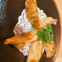 Gyoza · 5 pieces. Pan-fried Japanese style dumplings.