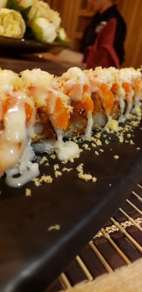 Salmonholic Roll · In: spicy salmon, shrimp tempura, and cucumber. Out: salmon, and crunchy. Sauce: yuzu, yum yum, apple, and onion sauce.