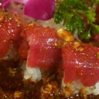 I love Tuna Roll · In: spicy tuna, and cucumber. Out: bluefin tuna, and green onion. Sauce: garlic ponzu, green...