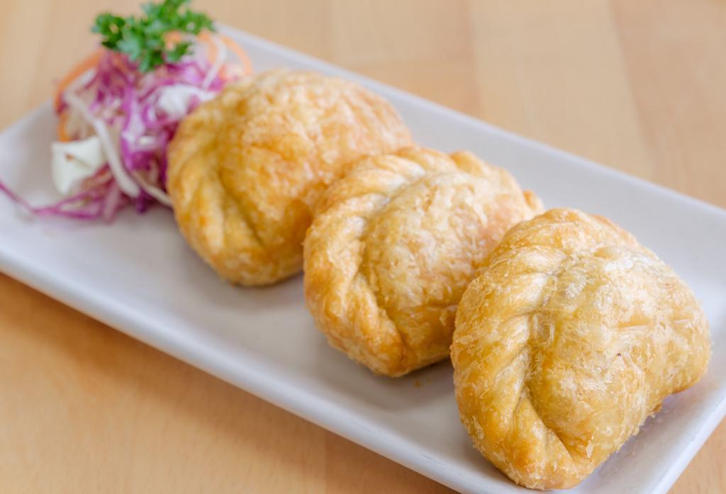 Curry Puff · Ground chicken, curry powder, peanut, carrot, onion, and potato.