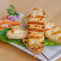 Chicken Satay · Marinated in Thai herbs and grilled on skewers served with homemade peanut sauce.