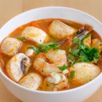 Tom Yum Soup · Lemongrass broth with shrimp & mushrooms. Hot and spicy.
