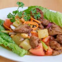 Vegetarian Duck Salad · Deep fried vegetarian duck with romaine, tomato, pineapple, and cashew nuts in spicy chili l...