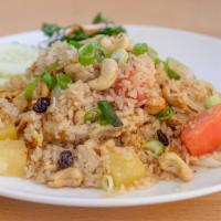 Pineapple Fried Rice · Fried rice with choice of meat, egg, cashew nuts, cilantro, onion, scallion, and pineapple.