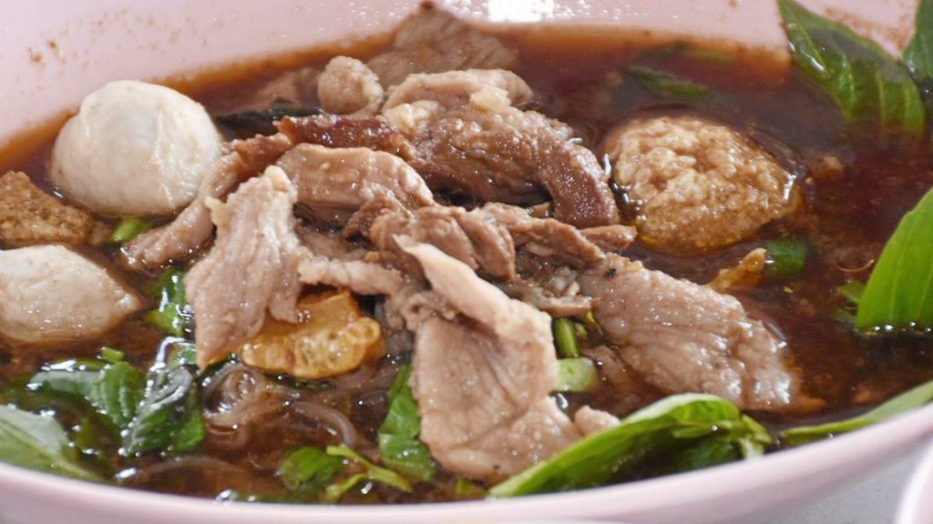 Nam Tok Noodle Soup · Rice noodle soup with choice of pork or beef and meatball.
