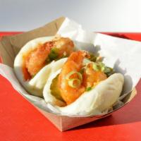 Shrimp Bao · Fried shrimp with honey sriracha glaze and pickles, topped with scallions.