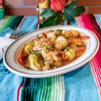 Camarones a la Veracruzana · Sauteed shrimps, peppers, olives, and capers in mild tomato sauce served with Mexican rice a...
