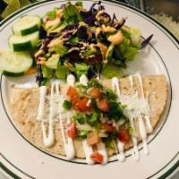 Tinga Quesadilla · Shredded chicken in chipotle sauce.