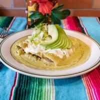 Enchiladas Suizas · 3 pieces of corn rolled tortillas filled with shredded chicken topped with jalapeno cream sa...