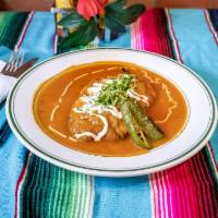 Chile Relleno · Cheese-filled poblano pepper, fried in egg batter topped with spiced tomato sauce served wit...
